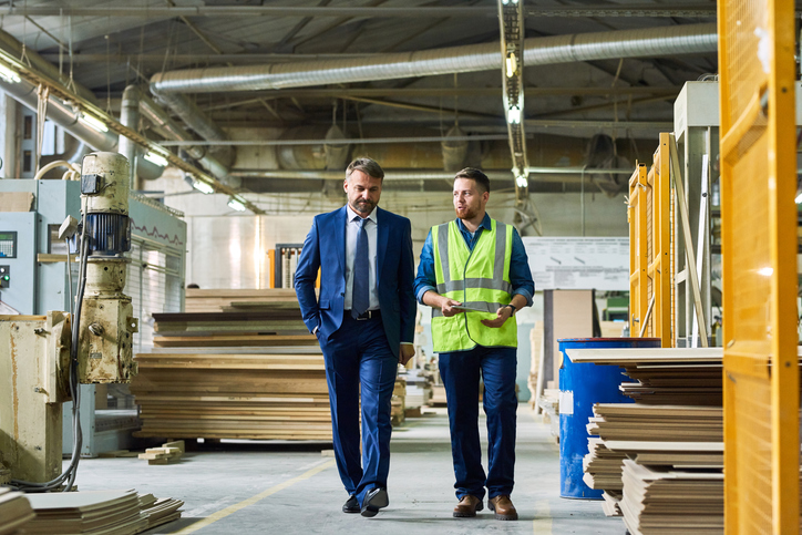 marketer and industrial worker talking