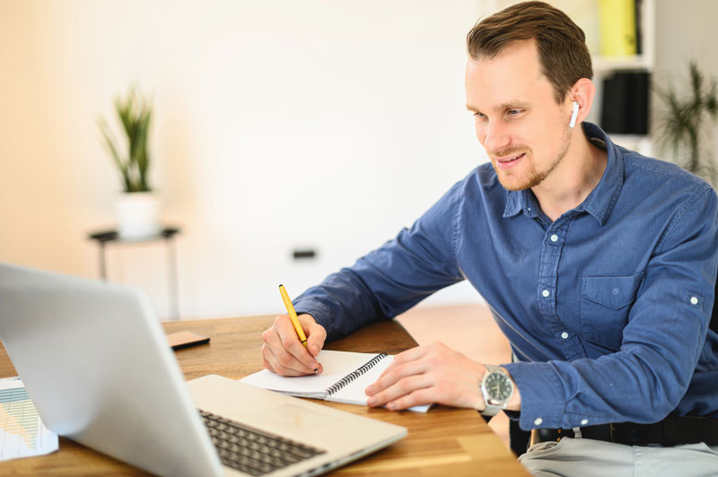 Schedule Consultation Person looking at laptop