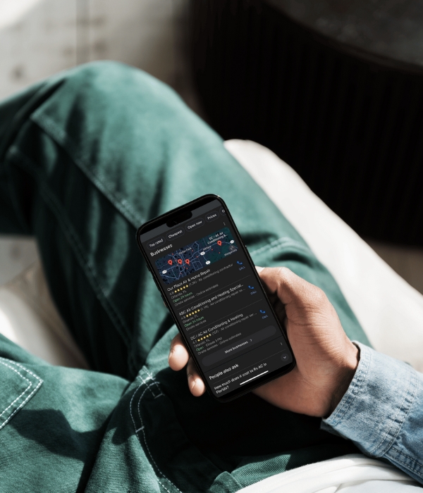 Person looking at Google Business Profile listings on mobile device