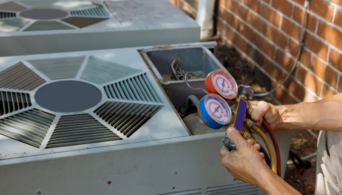 HVAC technician repairing ac unit