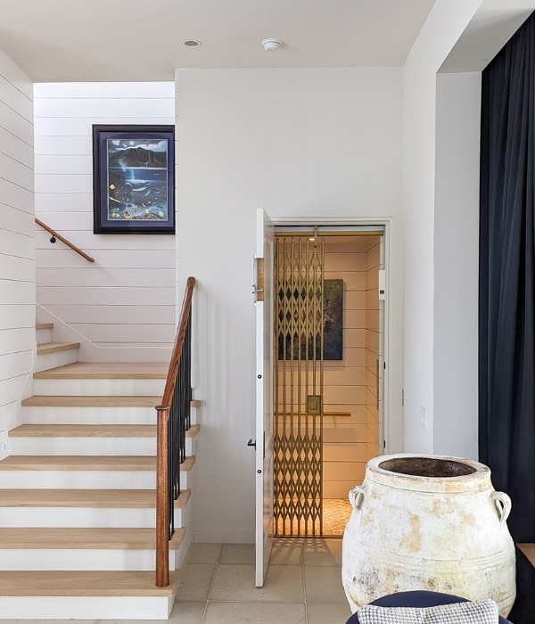 Image of home elevator next to stairs