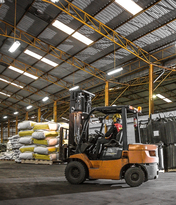 Manufacturing Marketing Person driving forklift in factory