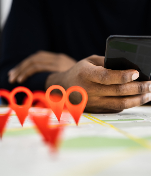 Person looking at map with location pins