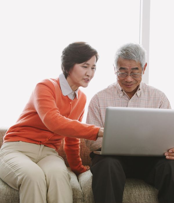 seniors at home with laptop