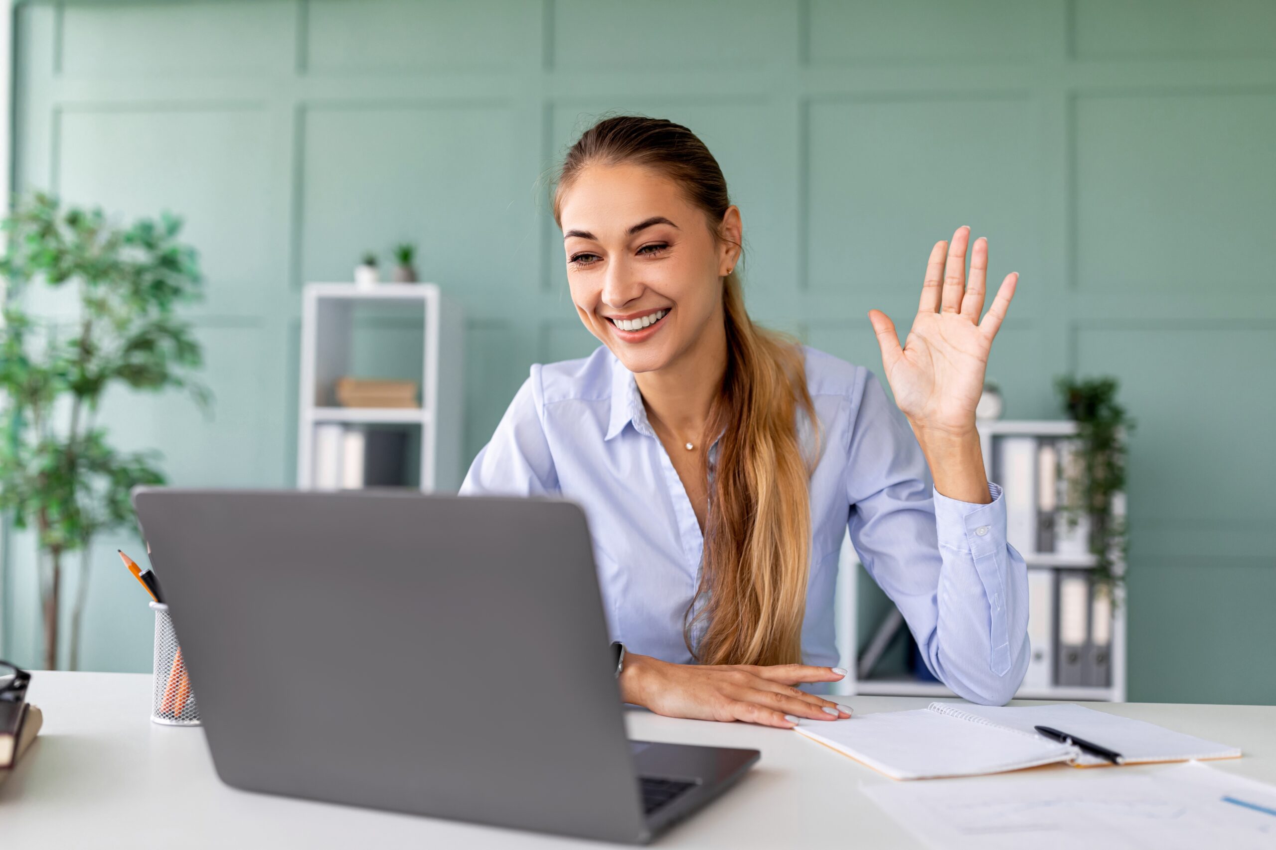 Happy,Woman,Participating,In,A,Virtual,Meeting,At,Home,While