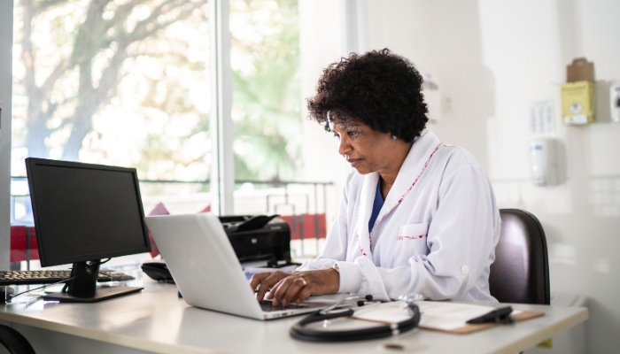 Doctor looking at computer