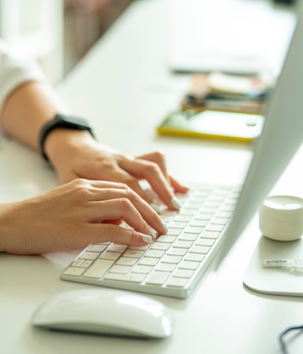 Person typing on keyboard