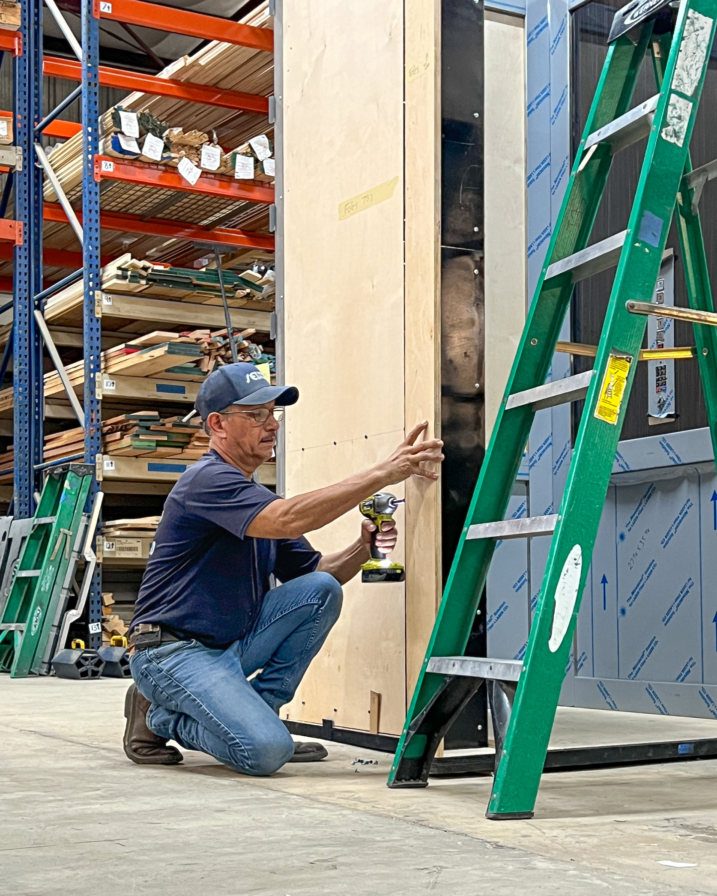 Elevator technician building a home elevator shell