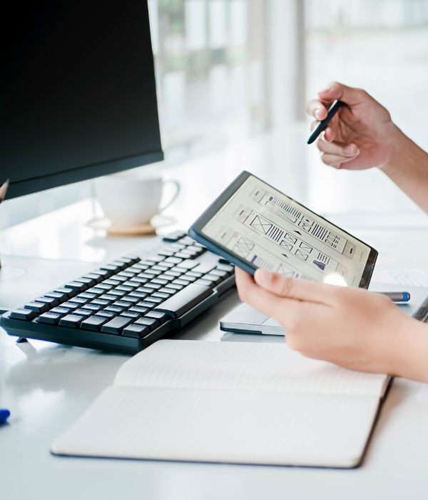 Person looking at website wireframes on a tablet