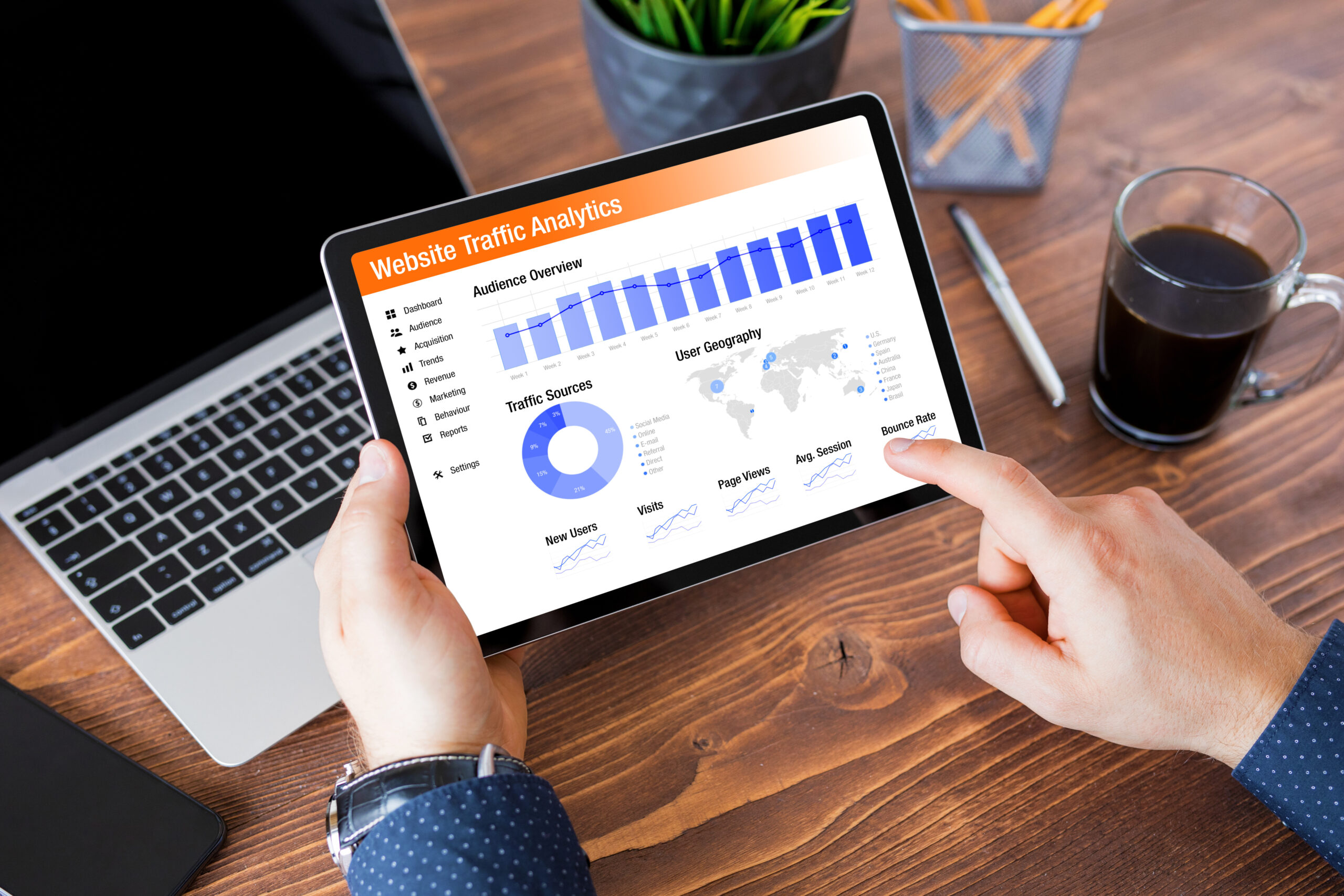 Person viewing Website Traffic Analytics report on a tablet