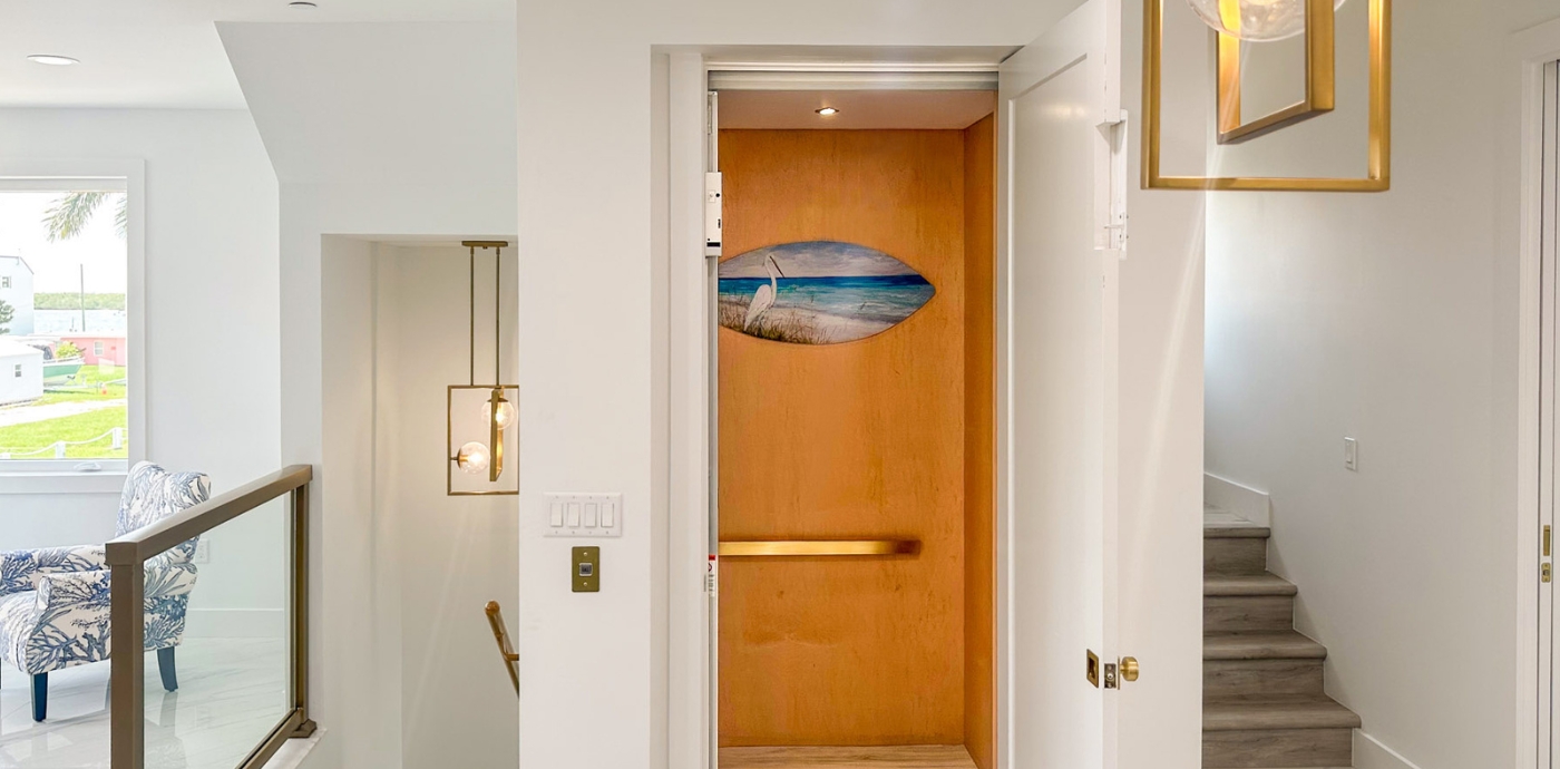 Image of a home elevator between two staircases