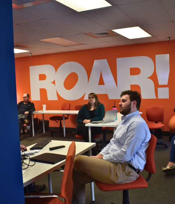 ROAR! team meeting together