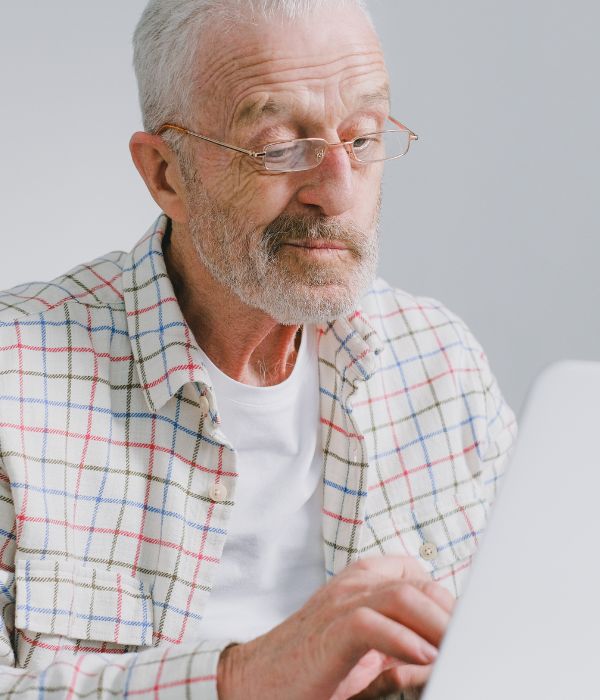 old man at computer